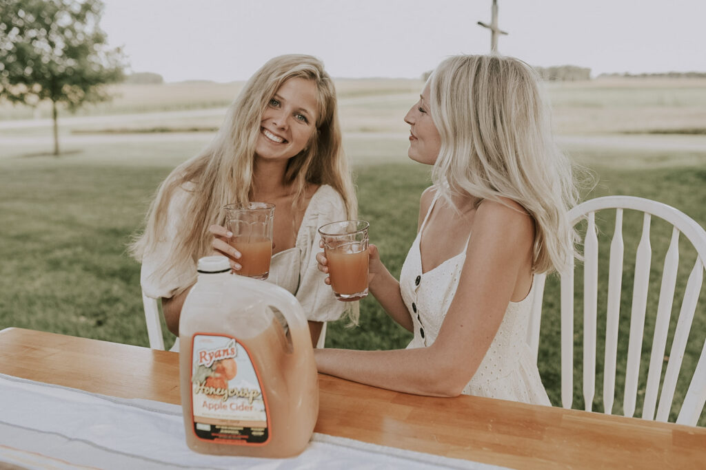 Two Women Drinking Ryan's Honeycrisp Apple Cider